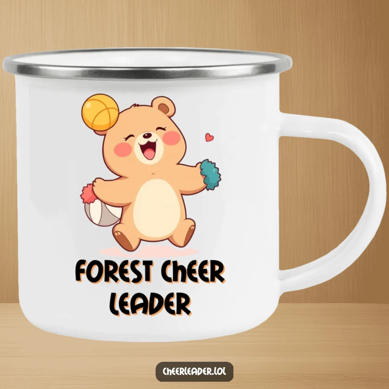 Funny enamel camping mug showing a delighted bear catching a ball with its pom-poms, ready for outdoor adventures and laughter.