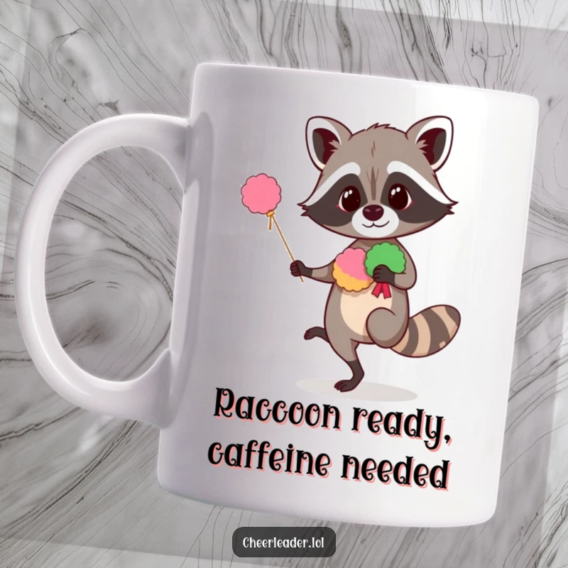 Funny raccoon mug showing a curious creature balancing on one leg with pom-poms, ready to cheer with whimsical energy.