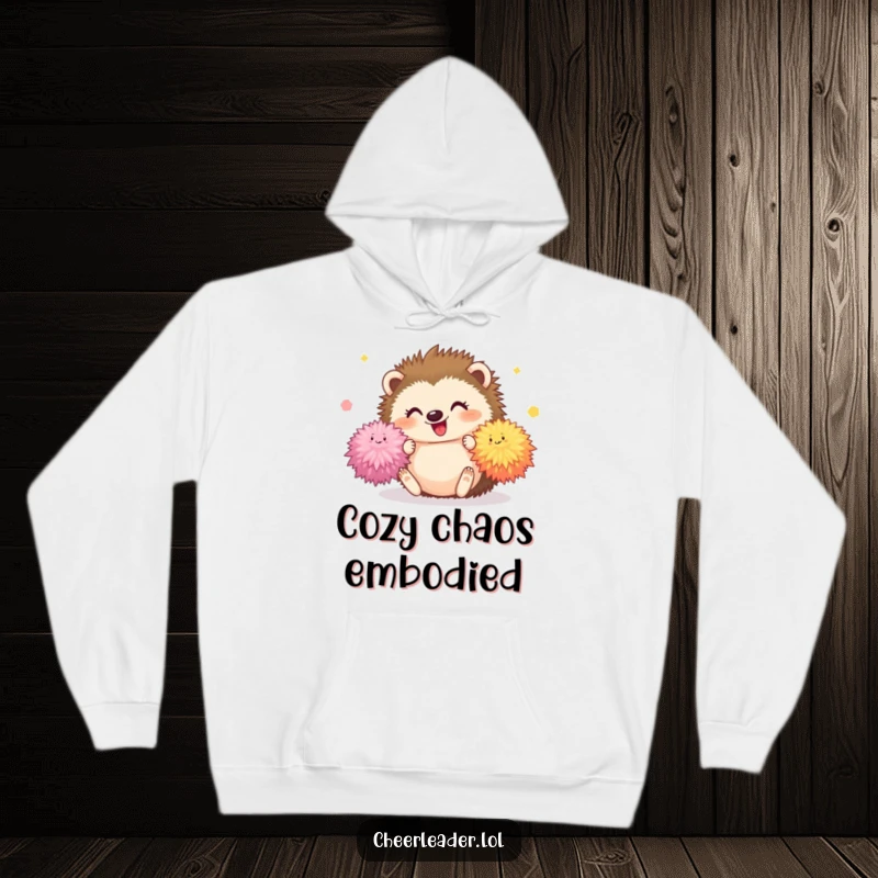 Funny Hedgehog Hoodie showing a happy hedgehog tumbling with fluffy pom-poms, cozy and cute for a humorous gift.