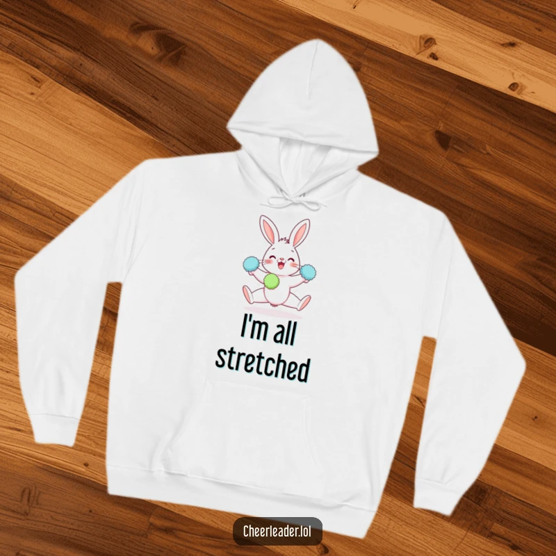 Funny hoodie illustration of a gleeful rabbit doing a split, pom-poms in paws, radiating pure cheerfulness.