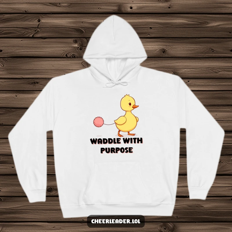 Funny Duckling Hoodie: A cozy hoodie featuring a wobbly duckling marching with a tiny pom-pom, embodying adorable determination.