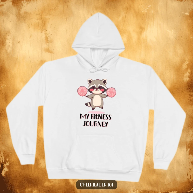 Funny hoodie illustration of a blushing raccoon jumping rope with two oversized pom-poms.