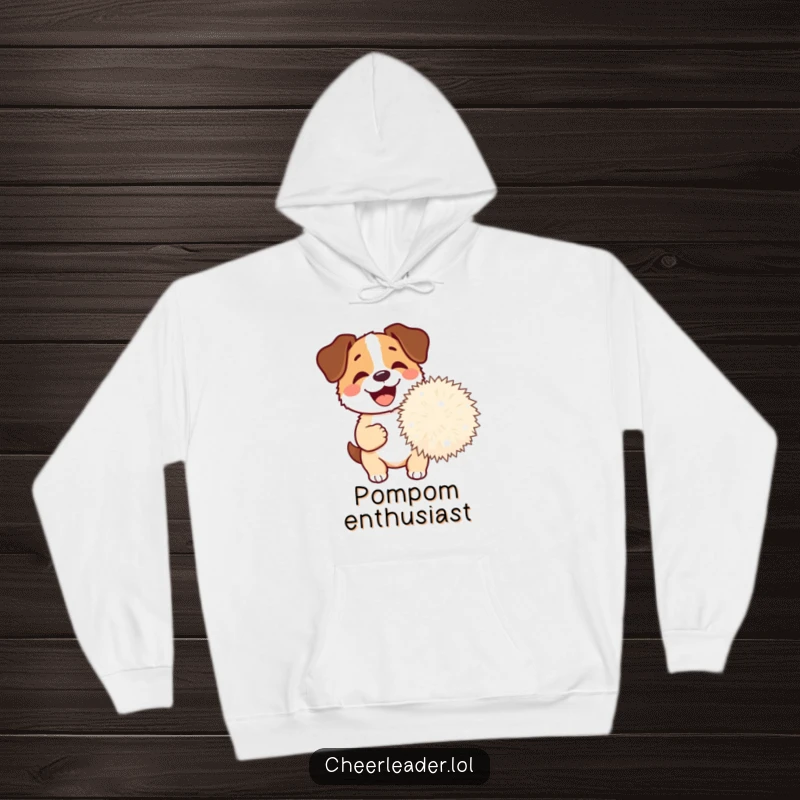 Funny Dog Pom-Pom Hoodie featuring a happy dog barking excitedly while holding a giant pom-pom, offering warmth and canine charm.