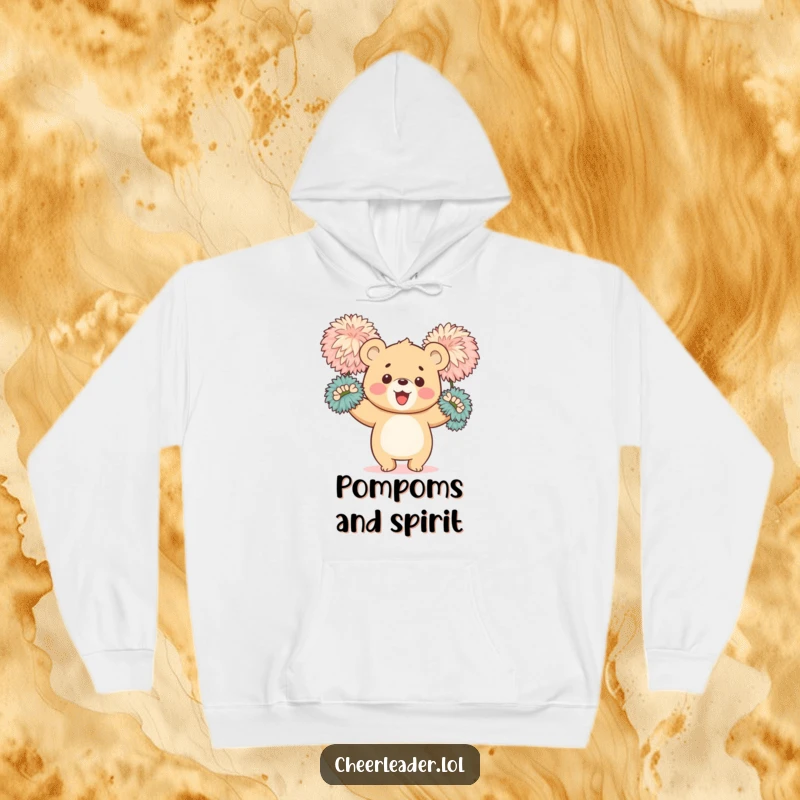 Funny hoodie depicting a happy bear cub enthusiastically waving large, fluffy pom-poms, radiating warmth and positive energy.