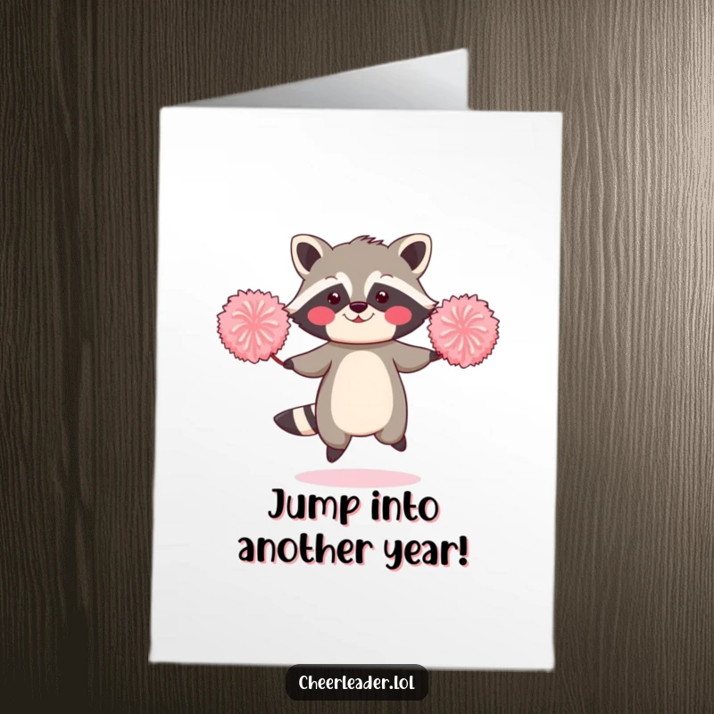 Funny Free Printable Birthday Card: Blushing raccoon skillfully jumping rope with large pom-poms, looking endearingly embarrassed. Great DIY gift.