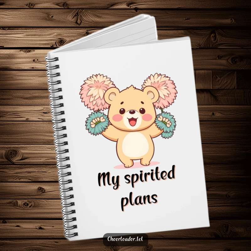 Funny notebook with a happy bear cub enthusiastically waving large, fluffy pom-poms, offering ample space for notes and motivational ideas.