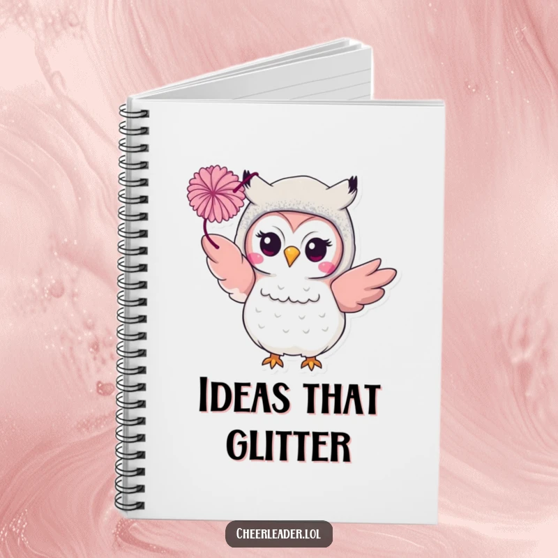 Funny smiling owl in a glittery costume, tossing a pom-pom on a notebook. Glamorous and inspiring journal.