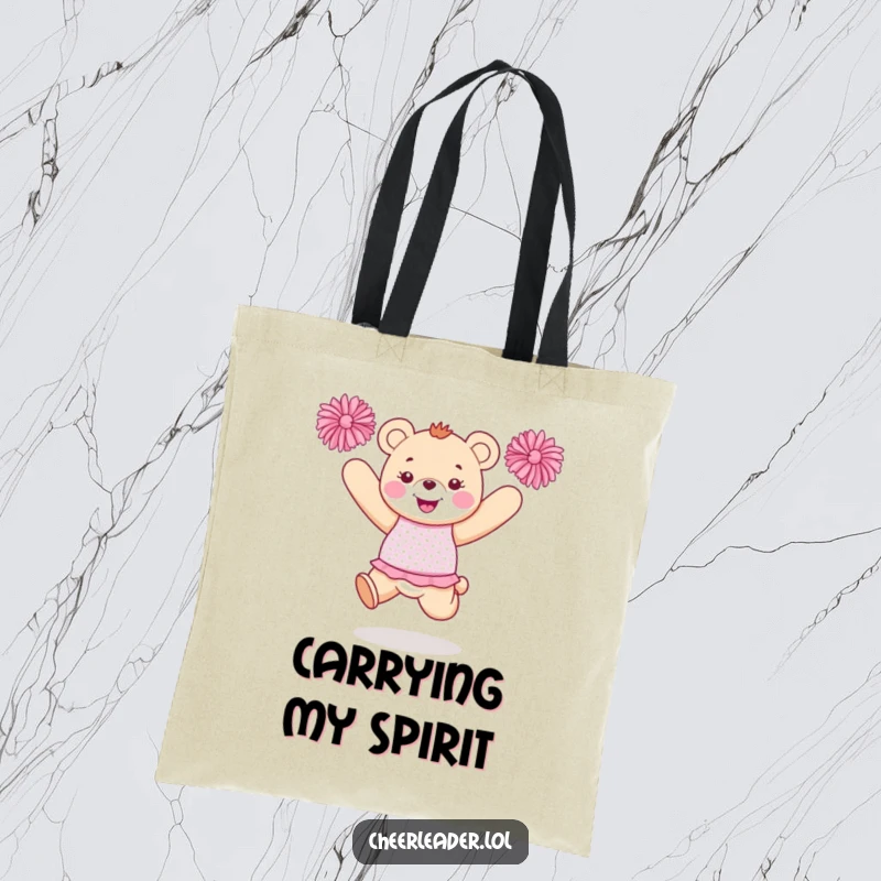 Funny bear cheerleader tote bag with a happy bear in a sparkly uniform jumping with pom-poms, perfect for carrying items.