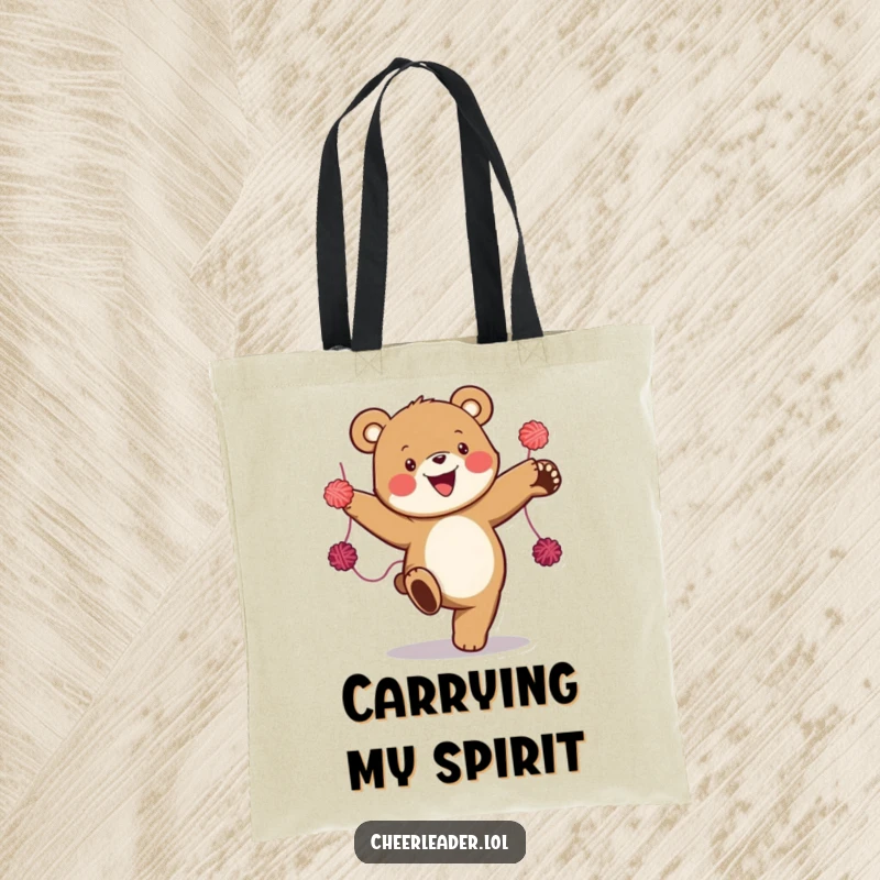 Funny tote bag with a happy bear executing a high kick while holding yarn pom-poms, showcasing a vibrant and energetic design.