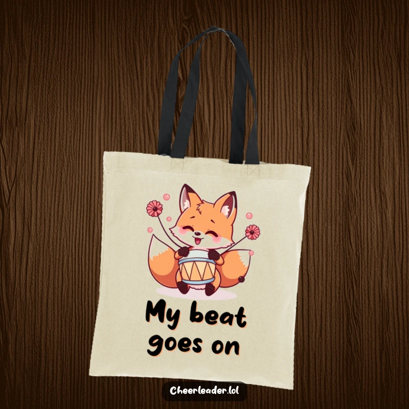 Funny fox enthusiastically drumming with pom-poms, printed on a durable and stylish tote bag.