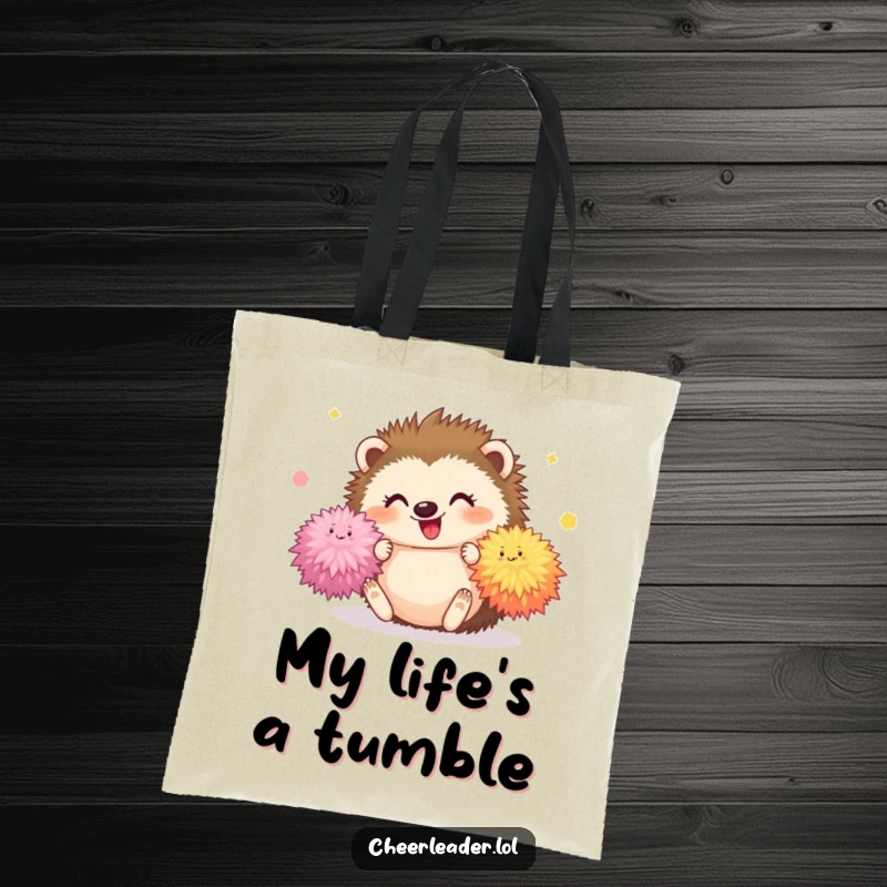 Funny Hedgehog Tote Bag featuring a happy hedgehog tumbling with bright pom-poms, a cute and humorous accessory.